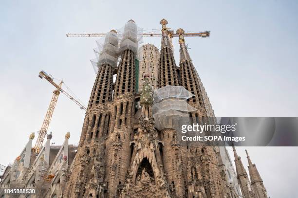 View of the Sagrada Familia, the largest unfinished Catholic church in the world which has been under construction for 144 years, and part of a...