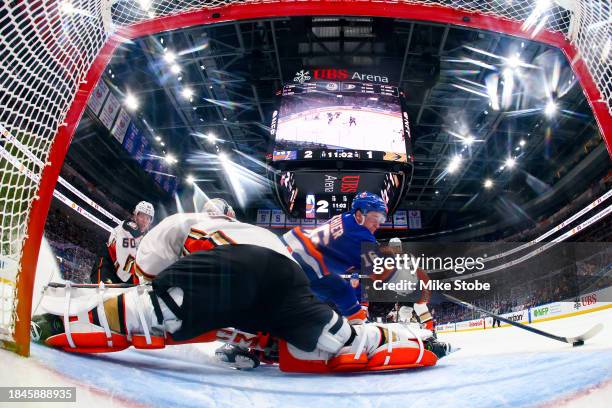 Julien Gauthier of the New York Islanders attempts a shot against John Gibson of the Anaheim Ducks during the second period at UBS Arena on December...