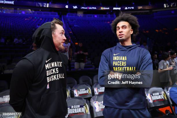 Pat Connaughton of the Milwaukee Bucks and Jordan Nwora of the Indiana Pacers talk before the game during the semifinals of the In-Season Tournament...