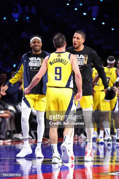 Tyrese Haliburton and T.J. McConnell of the Indiana Pacers celebrate during the game against the Milwaukee Bucks during the semifinals of the...