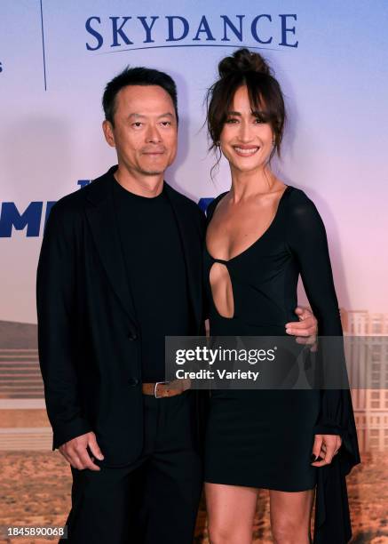 Maggie Q and guest at the world premiere of "The Family Plan" held at The Chelsea Theater at The Cosmopolitan on December 13, 2023 in Las Vegas,...