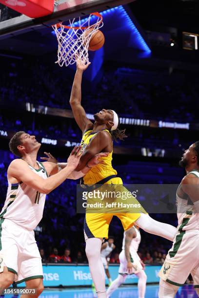 Myles Turner of the Indiana Pacers drives to the basket during the game against the Milwaukee Bucks during the semifinals of the In-Season Tournament...