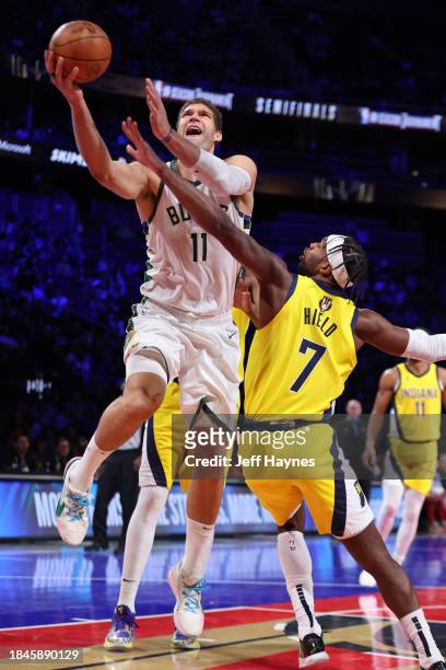 Brook Lopez of the Milwaukee Bucks drives to the basket during the game against the Indiana Pacers during the semifinals of the In-Season Tournament...