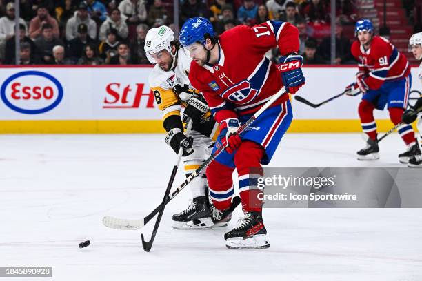 Pittsburgh Penguins defenseman Kris Letang defends the puck against Montreal Canadiens right wing Josh Anderson during the Pittsburgh Penguins versus...