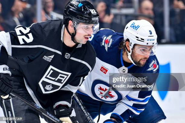 Kevin Fiala of the Los Angeles Kings and Alex Iafallo of the Winnipeg Jets get ready for the play during the second period at Crypto.com Arena on...