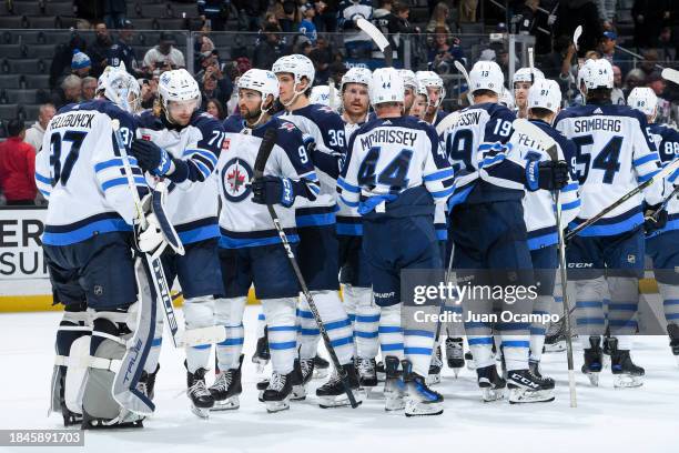 Winnipeg Jets celebrate their victory against the Los Angeles Kings at Crypto.com Arena on December 13, 2023 in Los Angeles, California.