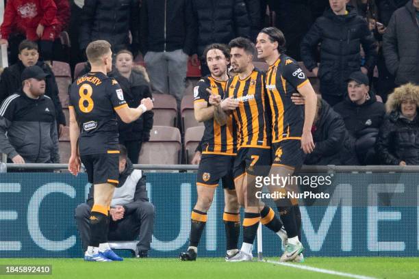 Ozan Tufan of Hull City is celebrating scoring the winning goal with his teammates during the Sky Bet Championship match between Middlesbrough and...