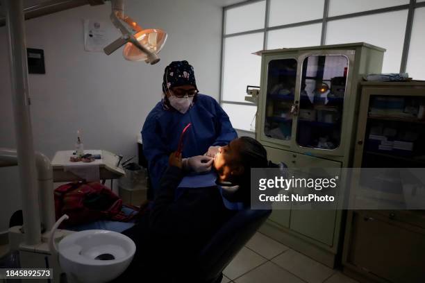 Dentist is performing tests with dental prostheses at the Centro de Odontogeriatria TIII Doctor Guillermo Roman y Carrillo Health Centre in the...