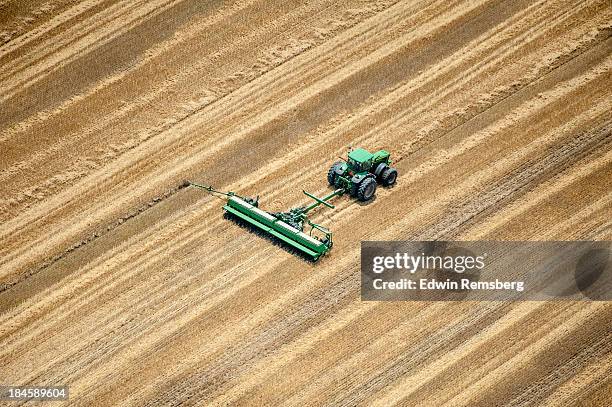 planting - tractor ploughing field bildbanksfoton och bilder