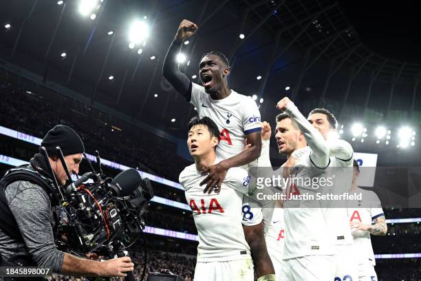 Son Heung-Min of Tottenham Hotspur celebrates with teammates after scoring their team's fourth goal from the penalty spot during the Premier League...