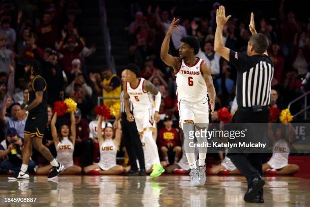 Bronny James of the USC Trojans reacts after his first career three-point basket during the second half against the Long Beach State 49ers at Galen...