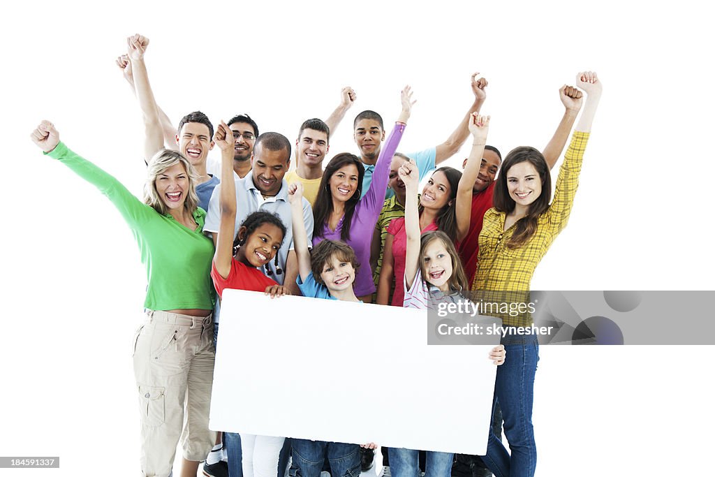 Large group holding a big white board.