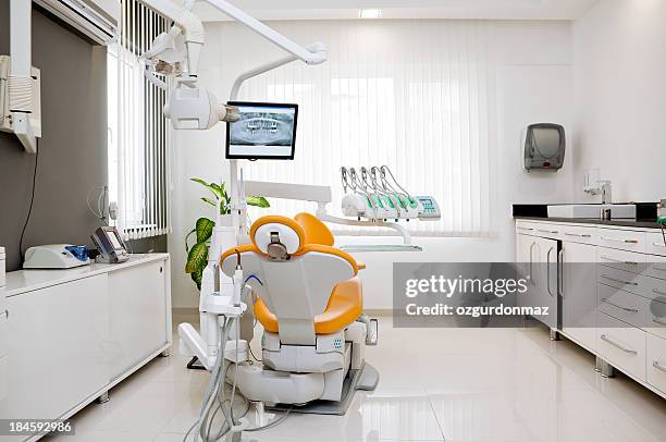 empty exam room at dentist's office - dentist's chair stock pictures, royalty-free photos & images