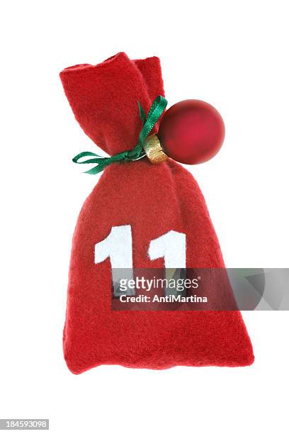 red christmas bag for advent calendar isolated on white - adventkalender stock pictures, royalty-free photos & images