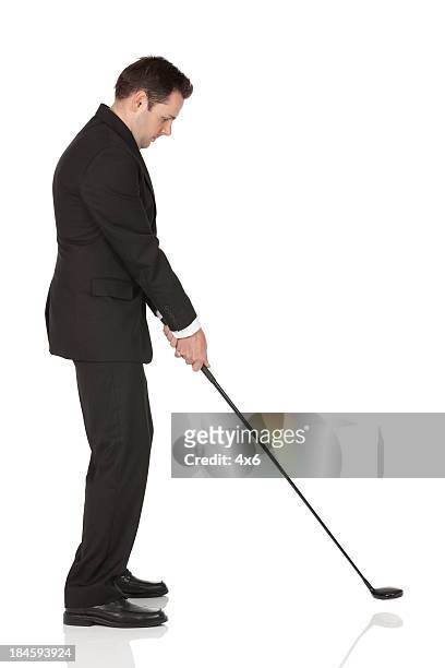 businessman playing golf - man studio shot stock pictures, royalty-free photos & images