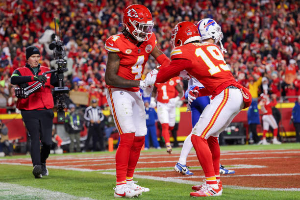 Rashee Rice of the Kansas City Chiefs reacts with Kadarius Toney after scoring a touchdown during the second half of the game against the Buffalo...