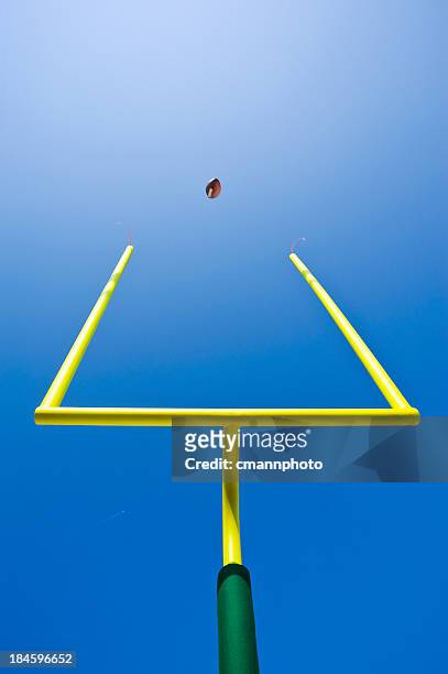 looking up at a field goal - american football - football goal post stock pictures, royalty-free photos & images