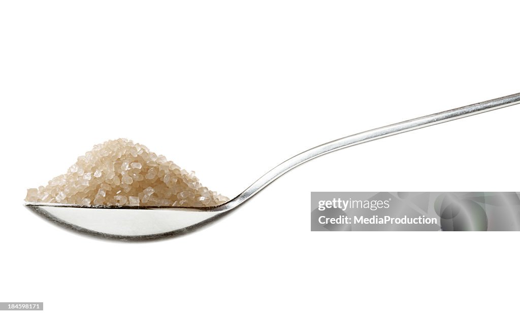 Brown sugar on tea spoon
