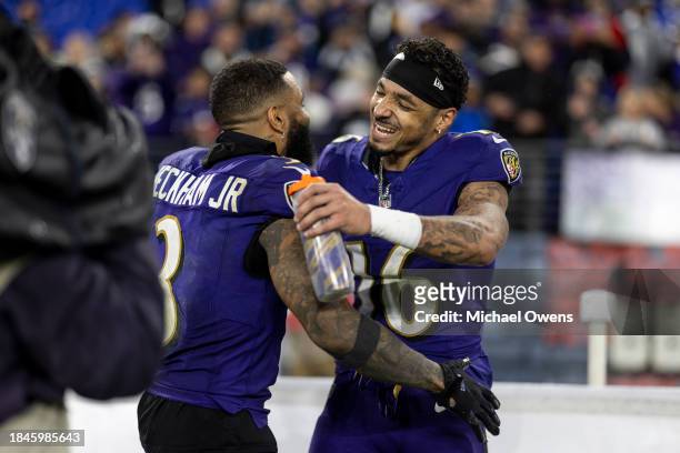 Tylan Wallace of the Baltimore Ravens celebrates with his teammate Odell Beckham Jr. #3 of the Baltimore Ravens after returning a punt for a...