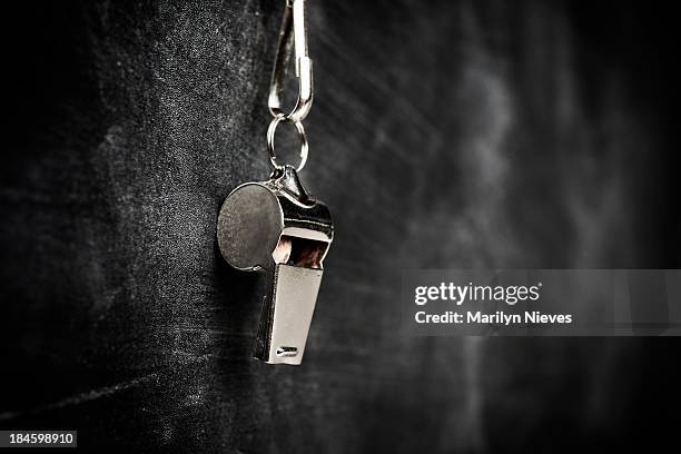 coach whistle hanging from board - hanging board stock pictures, royalty-free photos & images