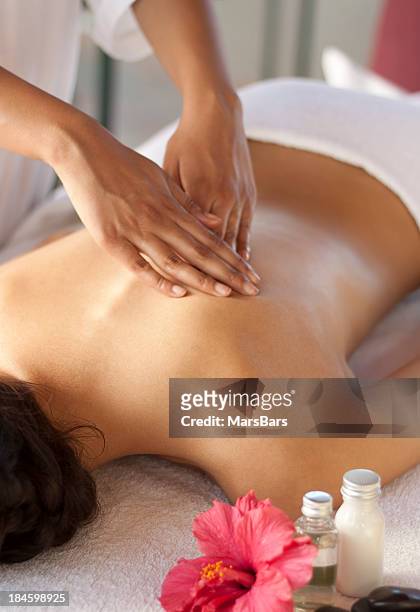 back massage at the spa - massage stock pictures, royalty-free photos & images