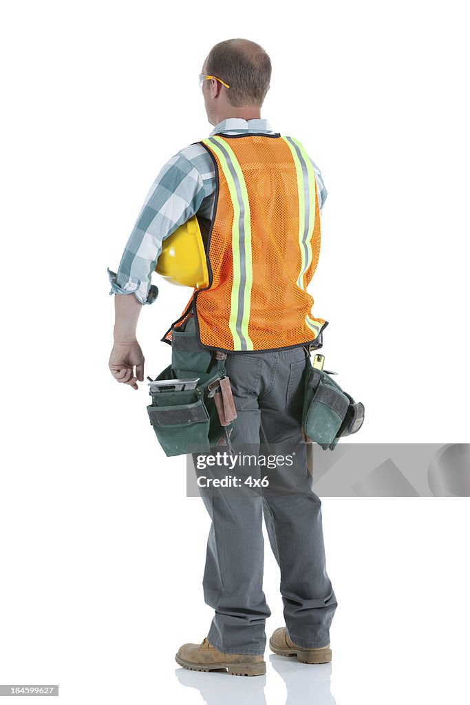 Rear view of a manual worker with hardhat