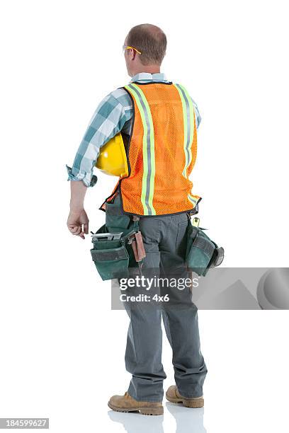 rear view of a manual worker with hardhat - blue collar construction isolated stock pictures, royalty-free photos & images