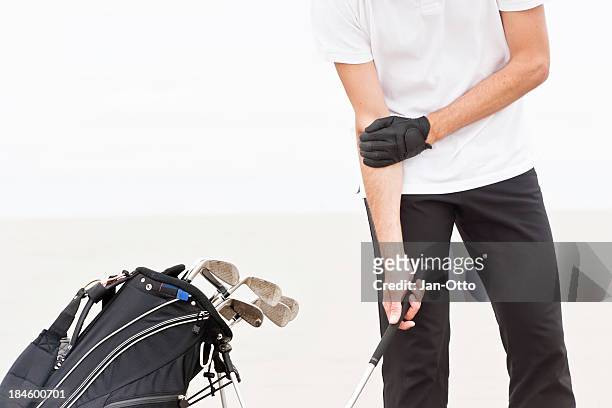 pain in elbow of a golfer - 肘 個照片及圖片檔