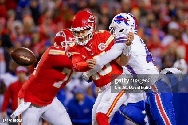 Von Miller of the Buffalo Bills hits Patrick Mahomes of the Kansas City Chiefs to force an incomplete pass during the second half of the game at GEHA...