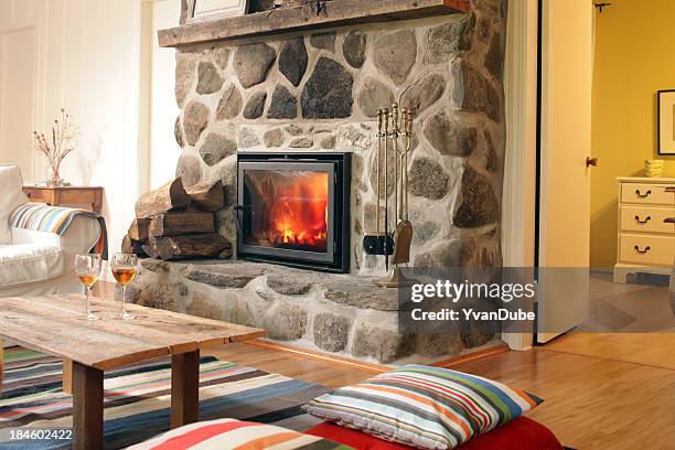 log cabin fireplace - fireplace stock pictures, royalty-free photos & images
