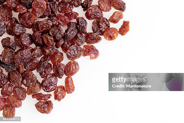 raisins on white with copy space - raisin stock pictures, royalty-free photos & images
