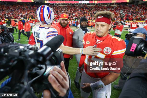 Patrick Mahomes of the Kansas City Chiefs reacts with Josh Allen of the Buffalo Bills after the game at GEHA Field at Arrowhead Stadium on December...
