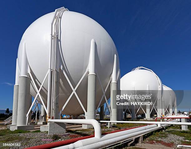 storage tanks at a petrochemical plant - gasoline storage stock pictures, royalty-free photos & images