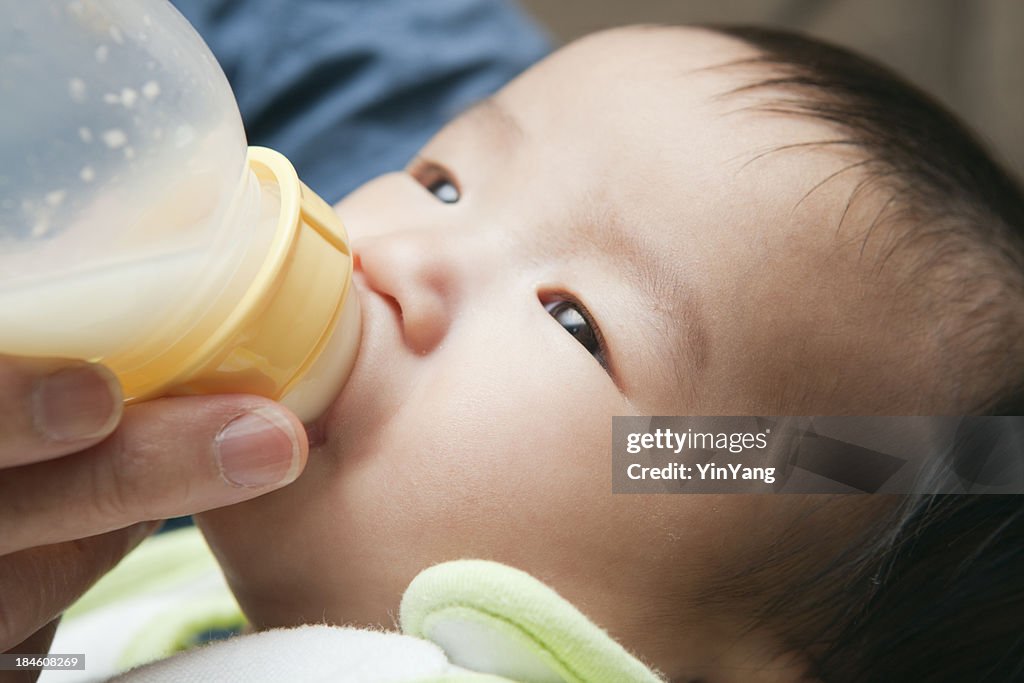 Asian Chinese Baby Feeding on Bottle CLose-up