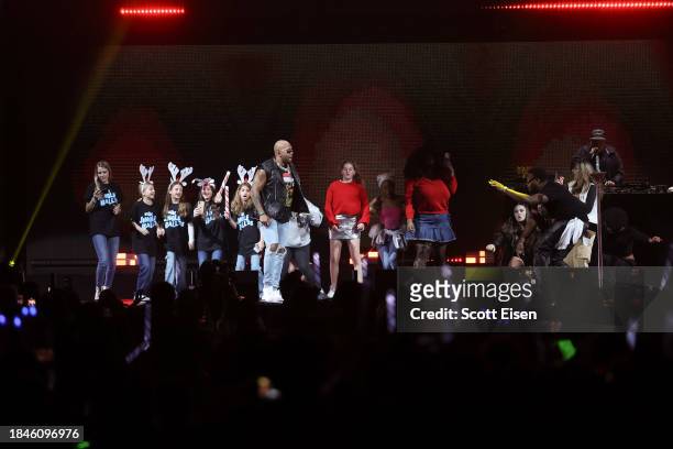 Flo Rida performs onstage with fans during iHeartRadio KISS108's Jingle Ball 2023 at TD Garden on December 10, 2023 in Boston, Massachusetts.