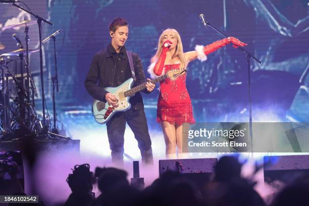 Sabrina Carpenter performs onstage with her band during iHeartRadio KISS108's Jingle Ball 2023 at TD Garden on December 10, 2023 in Boston,...