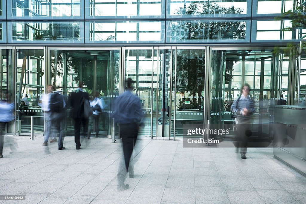 Business People Entering and Exiting an Office Building, Blurred Motion