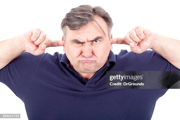 angry man covering his ears - hands covering ears stock pictures, royalty-free photos & images
