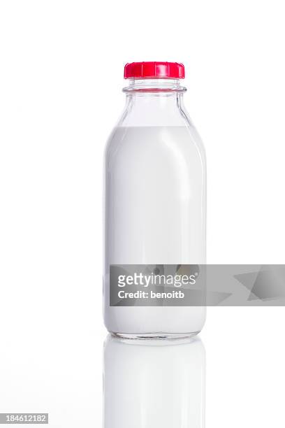 fresh glass bottle of milk with a red lid - mjölkflaska bildbanksfoton och bilder