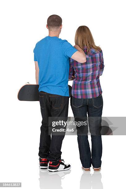 rear view of a couple with skateboard - blonde hair rear white background stock pictures, royalty-free photos & images