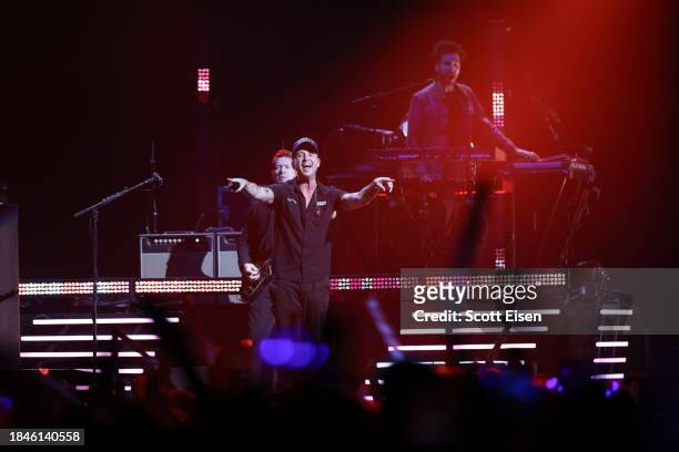Zach Filkins, Ryan Tedder, and Brian Willet of One Republic perform onstage during iHeartRadio KISS108's Jingle Ball 2023 at TD Garden on December...