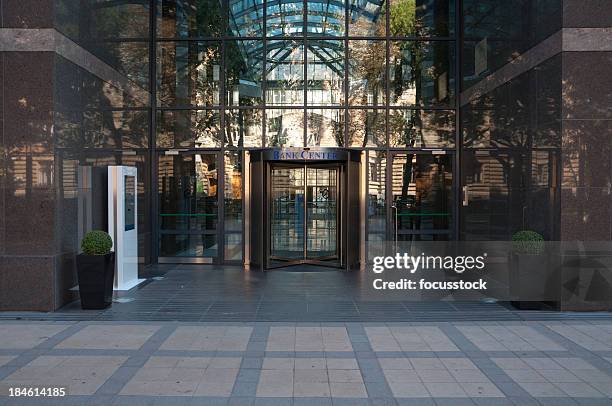 glassy bank center with reflections from outside - bank building stockfoto's en -beelden