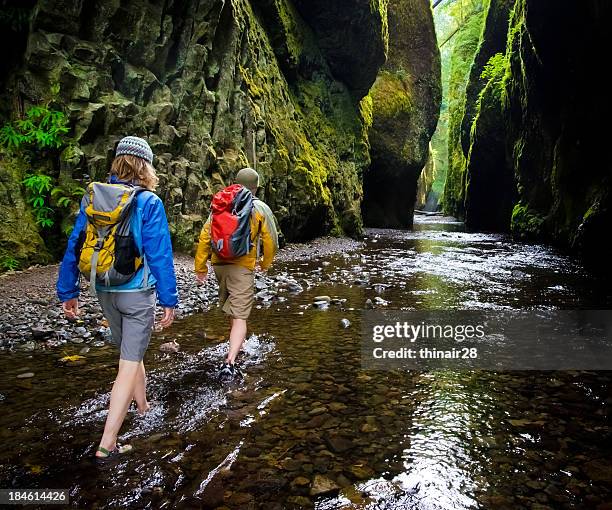 couple hiking in canyon - columbia river gorge oregon stock pictures, royalty-free photos & images