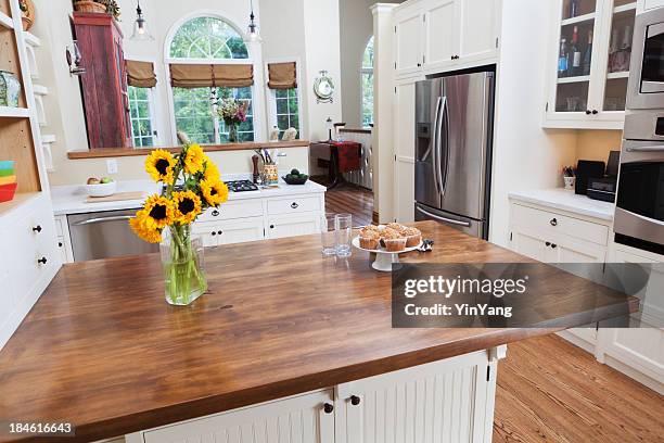 contemporary classically designed showcase kitchen and dining room - kitchen bench wood stock pictures, royalty-free photos & images