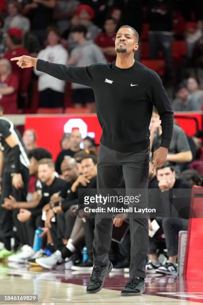 Head coach Kim English of the Providence Friars signals to his players during a college basketball game against the Oklahoma Sooners at Lloyd Noble...