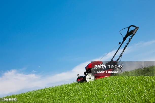 lawn mower in the grass - lawn mower stock pictures, royalty-free photos & images