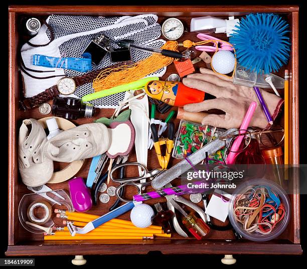 junk drawer with many miscellaneous objects - passes stock pictures, royalty-free photos & images