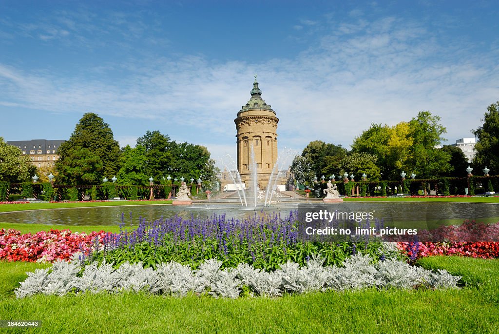 Outdoor photo Mannheim fountain with blooming flowers