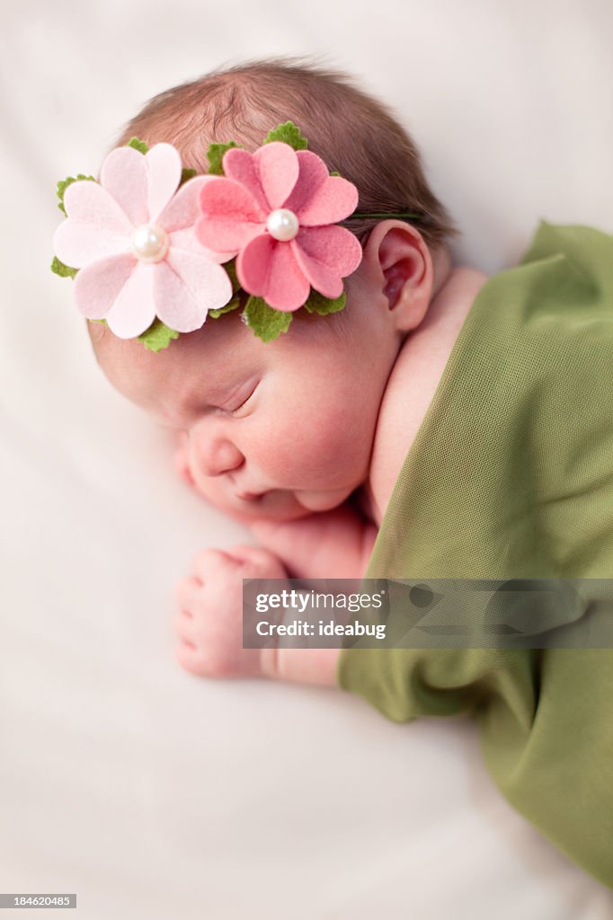 Beautiful Newborn Baby Girl Swaddled in Soft, Green Blanket