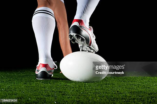 close up of man playing a rugby ball - rugby league stockfoto's en -beelden